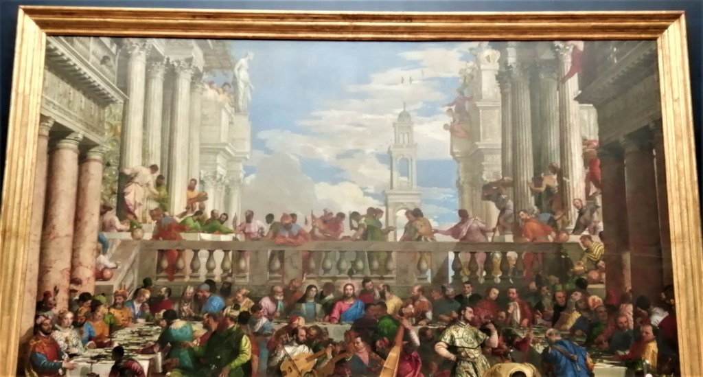 Il grande dipinto di Veneziano "Le nozze di Cana" esposto al Louvre, in cui sono presenti, oltre a Gesù e ai 12 apostoli, anche numerosi altri personaggi che seguono la scena la quale si svolge in un contesto classico tra portici e colonnati.